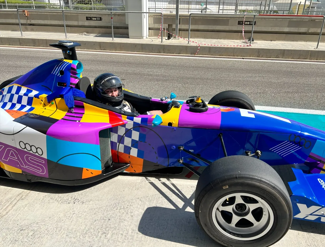 Ali driving a Formula car