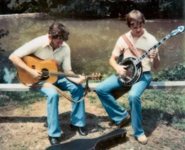 Jim Pankey playing banjo with a friend in the late 1970s