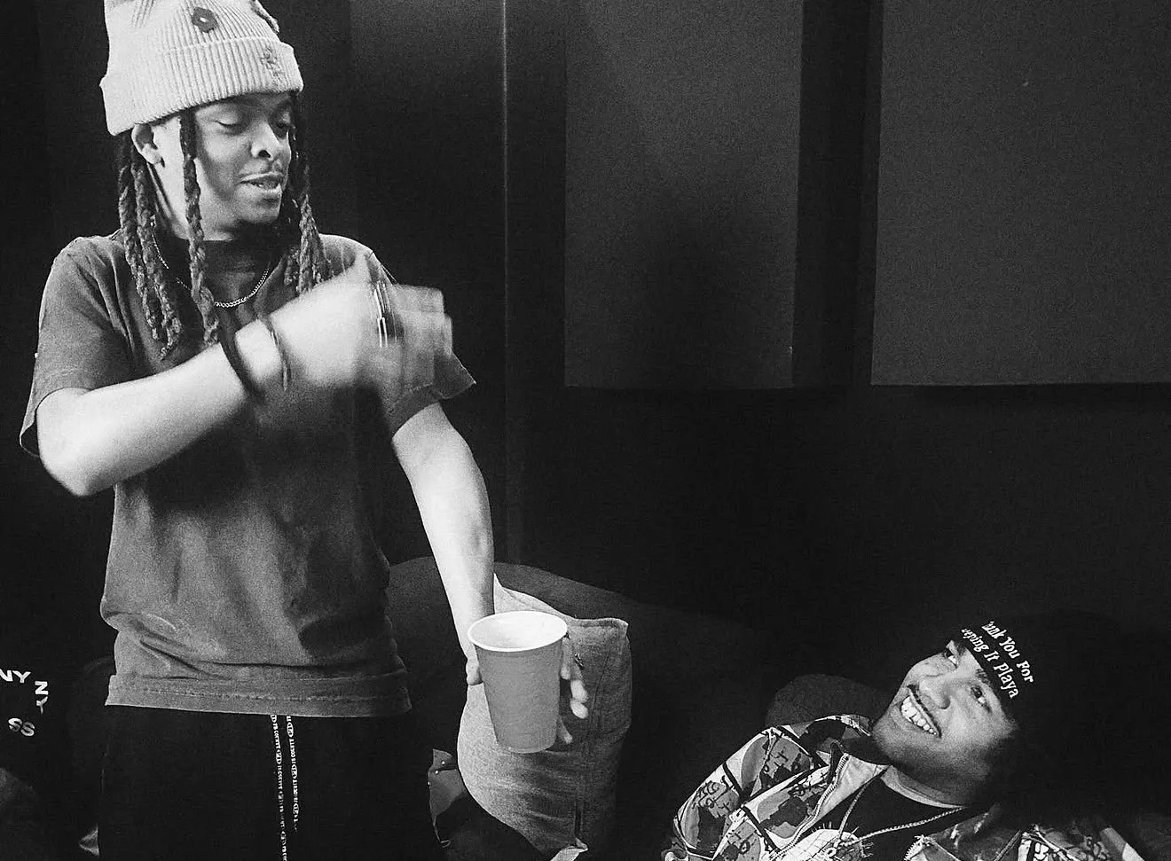 Raymond Herring laughing with a friend in the studio